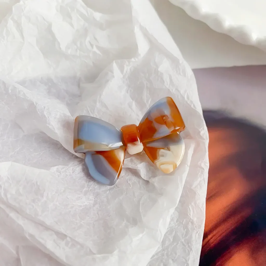 amber-blue-bow-cellulose-acetate-hair-clip-detail