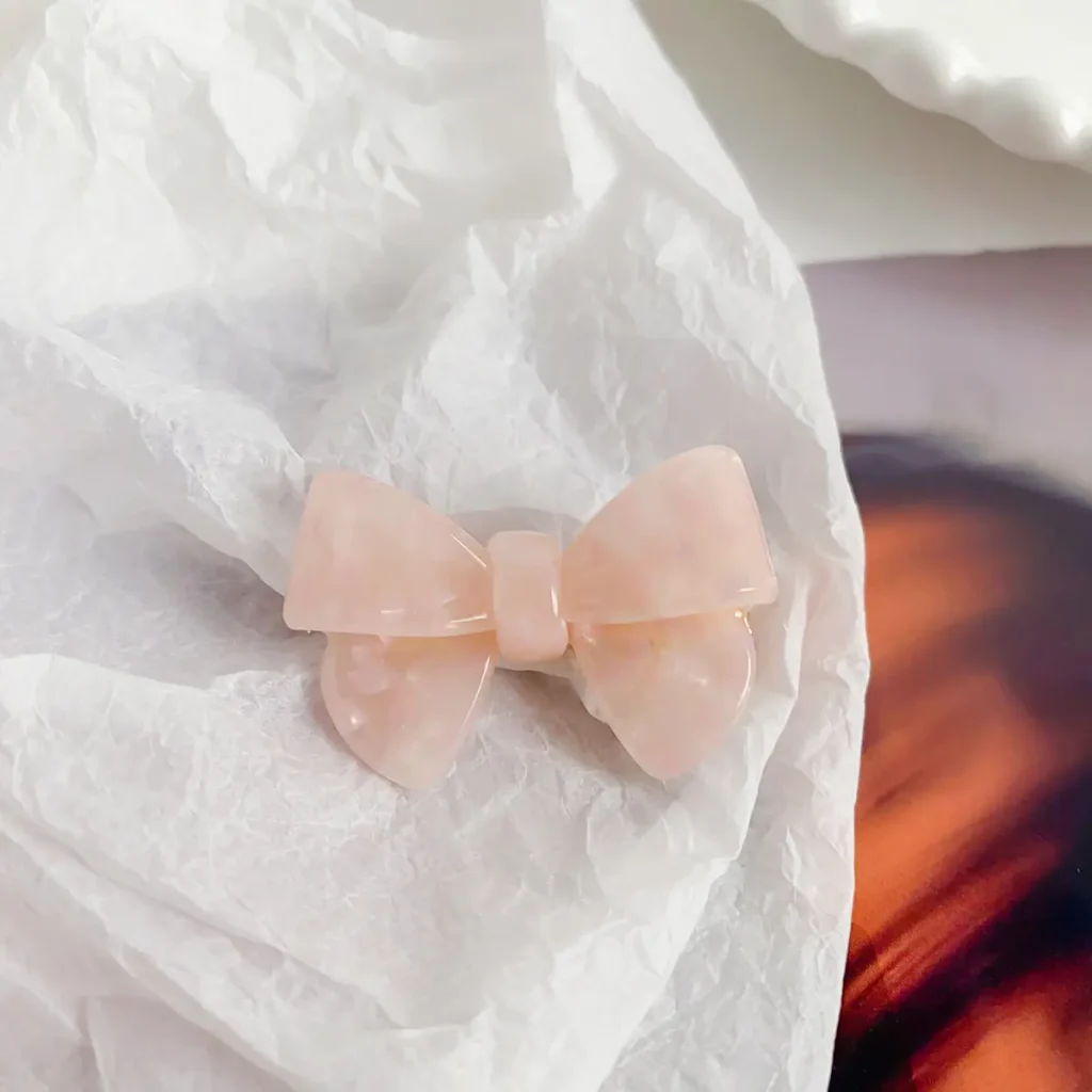 blush-pink-bow-cellulose-acetate-hair-clip-detail