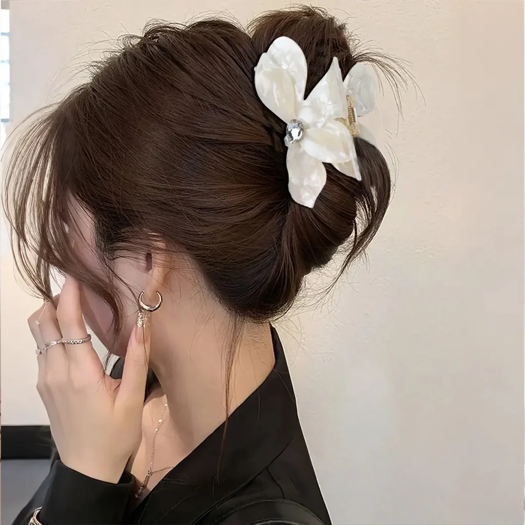 white-flower-cellulose-acetate-hair-claw-clip-model-wearing.jpg